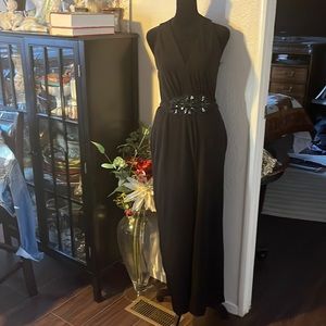 Black Saks, fifth avenue size 4 jumpsuit with detailed belt